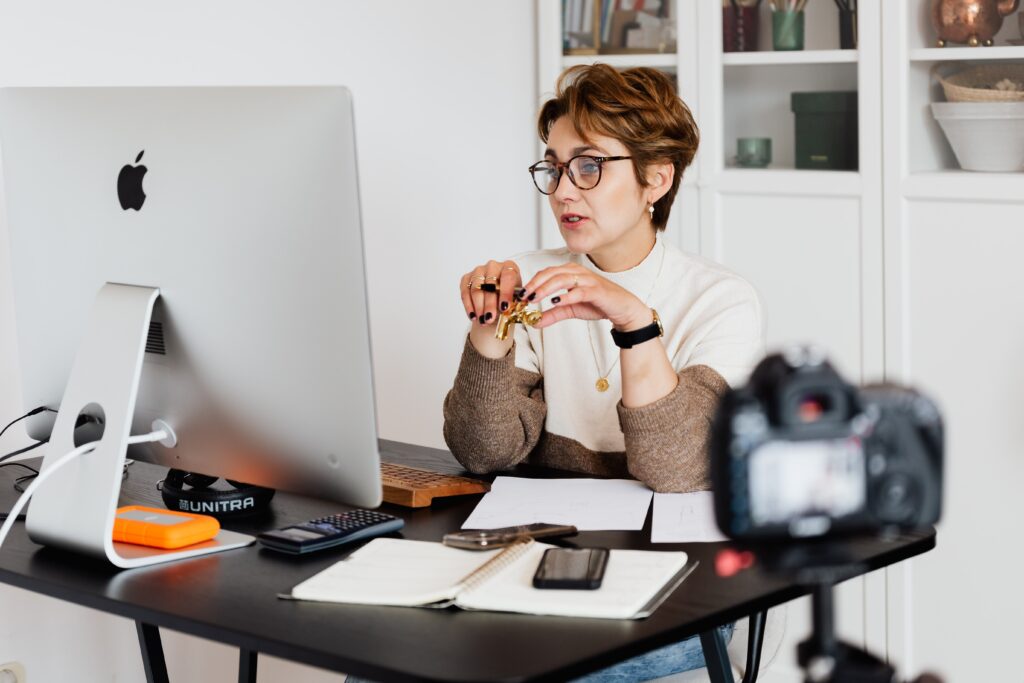 A woman live streaming in internal communication.